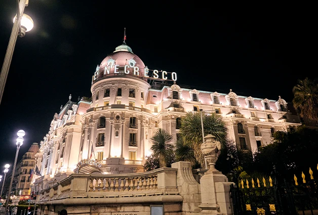 Night view of Le Negresco Hotel during Raquel's 2023 Nice Tour