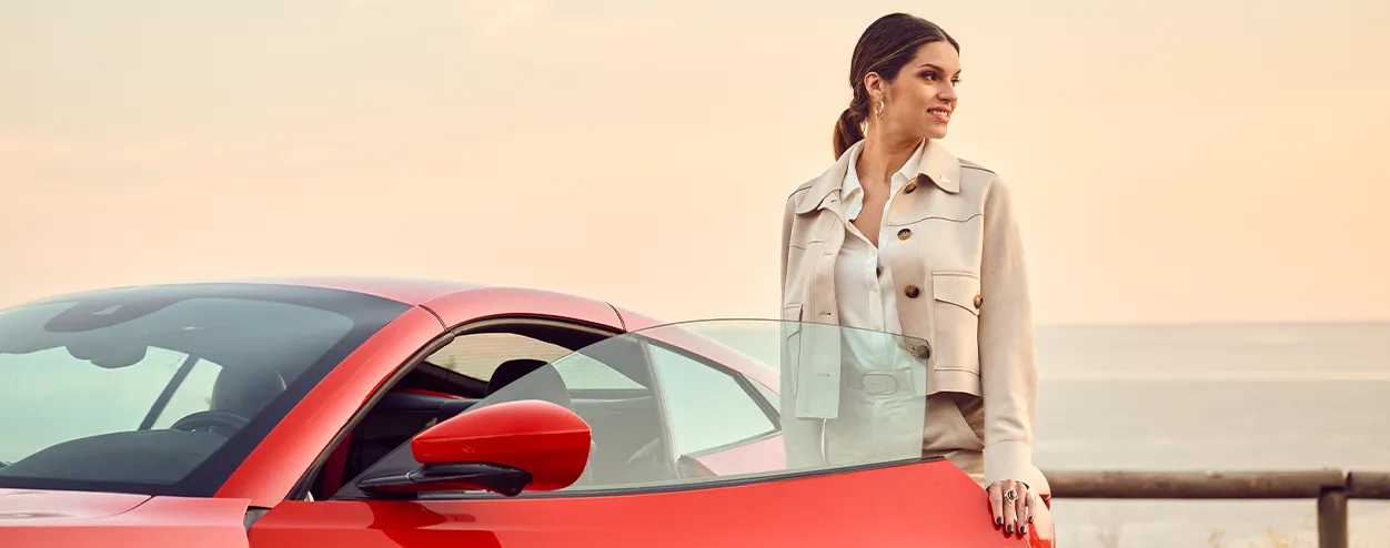 Raquel Romans with a Ferrari Portofino